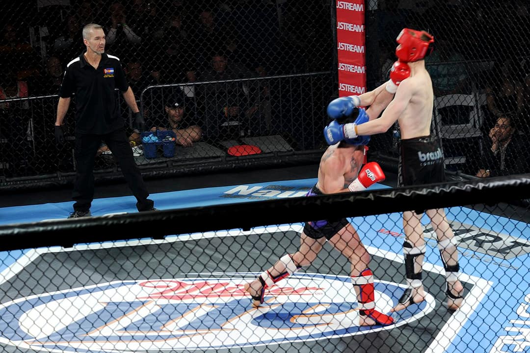 Mixed martial arts action inside the cage